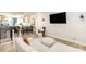 Bright living room features a large sectional sofa, TV, and an open view to the kitchen at 3526 Saker Ln, Charlotte, NC 28211