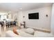 Spacious living room with TV, sofa, and open layout to dining and kitchen areas at 3526 Saker Ln, Charlotte, NC 28211