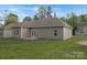 The backyard features a sprawling lawn and exterior of the single story home at 3708 Small Ave, Charlotte, NC 28269