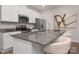 Modern kitchen with granite countertops, stainless steel appliances, and a breakfast bar with seating at 3708 Small Ave, Charlotte, NC 28269