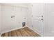 The laundry room boasts wood-look flooring and is equipped with necessary hookups at 3708 Small Ave, Charlotte, NC 28269