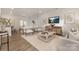 Modern living room features an open-concept layout with neutral tones, stylish decor, and hardwood floors at 3708 Small Ave, Charlotte, NC 28269