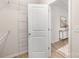 A view inside the walk-in closet with metal shelving, and a doorway leading to a bedroom at 3708 Small Ave, Charlotte, NC 28269