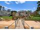 Stunning brick home with terraced backyard, lush landscaping, and private beach access at 3988 Channel Point Ln, Denver, NC 28037