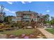 Beautiful brick home with tiered landscaping, a putting green, and outdoor entertaining spaces at 3988 Channel Point Ln, Denver, NC 28037
