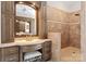 Elegantly styled bathroom featuring a vanity with marble countertop and a walk-in shower at 3988 Channel Point Ln, Denver, NC 28037