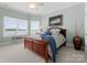 Inviting bedroom with water views, large windows, and cozy decor for a relaxing ambiance at 3988 Channel Point Ln, Denver, NC 28037