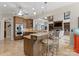Open-concept kitchen with stainless steel appliances, an island with seating, and views into the living area at 3988 Channel Point Ln, Denver, NC 28037