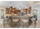 Large kitchen island with seating and pendant lighting, seamlessly connected to dining and living areas at 3988 Channel Point Ln, Denver, NC 28037