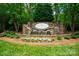 Beautiful stone Sailview neighborhood entrance with a waterfall feature and lush landscaping at 3988 Channel Point Ln, Denver, NC 28037