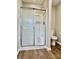 Bathroom featuring a walk-in shower with glass enclosure and a standard toilet at 4418 Palustris Ct, Charlotte, NC 28269