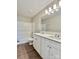 Bathroom featuring a double sink vanity, modern lighting, and a shower-tub combo at 4418 Palustris Ct, Charlotte, NC 28269