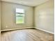Bedroom with wood-look floors and neutral paint and a view from the window at 4418 Palustris Ct, Charlotte, NC 28269