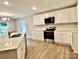 New kitchen featuring white cabinetry, quartz countertops and stainless-steel appliances at 4418 Palustris Ct, Charlotte, NC 28269