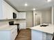 Bright kitchen featuring white cabinetry, quartz countertops, and stainless-steel appliances at 4418 Palustris Ct, Charlotte, NC 28269
