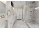 Elegant bathroom with double sink vanity, white cabinets, a glass shower, and marble tile floors at 4628 Sierra View Dr, Denver, NC 28037