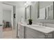 Bathroom features a double vanity with a light paint color and decorative mirrors at 4628 Sierra View Dr, Denver, NC 28037