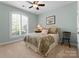 Inviting bedroom with decorative window, patterned bedding, and neutral walls at 4628 Sierra View Dr, Denver, NC 28037