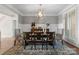 The formal dining area showcases a striking light fixture and ample space for entertaining at 4628 Sierra View Dr, Denver, NC 28037