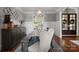 An elegant dining room boasts wood floors, statement lighting, and decorative wainscoting details at 4628 Sierra View Dr, Denver, NC 28037