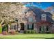 Charming brick home with beautiful stone accents and lush landscaping at 4628 Sierra View Dr, Denver, NC 28037