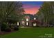 Stunning two-story brick home with lush landscaping, well-manicured lawn and inviting front entrance at 4628 Sierra View Dr, Denver, NC 28037