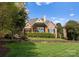 Beautiful brick home with a well-manicured lawn and picturesque landscaping at 4628 Sierra View Dr, Denver, NC 28037