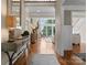 Inviting hallway with hardwood floors and lake views from the living room at 4628 Sierra View Dr, Denver, NC 28037