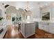 Open concept kitchen with large island, farm sink, and dining area at 4628 Sierra View Dr, Denver, NC 28037