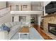 Inviting living room boasts a stone fireplace, hardwood floors, and comfortable seating at 4628 Sierra View Dr, Denver, NC 28037