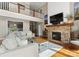 Bright living room with stone fireplace, hardwood floors, cathedral ceiling, and a beautiful upstairs landing at 4628 Sierra View Dr, Denver, NC 28037