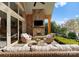 Relaxing outdoor patio with a stone fireplace and comfortable seating area at 4628 Sierra View Dr, Denver, NC 28037