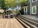 Multi-level wooden deck featuring grilling and dining area with access to the backyard at 4823 Antioch Church Rd, Weddington, NC 28104