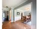 Bright dining room with hardwood floors, white wainscoting, and a wooden dining table at 4823 Antioch Church Rd, Weddington, NC 28104
