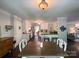 Charming dining room with a dark wood table, hardwood floors, and access to the kitchen and living room at 4823 Antioch Church Rd, Weddington, NC 28104
