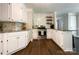 Bright kitchen with white cabinets, granite countertops, and stainless steel appliances at 4823 Antioch Church Rd, Weddington, NC 28104