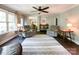 Cozy living room with hardwood floors, neutral walls, a ceiling fan, and a large area rug at 4823 Antioch Church Rd, Weddington, NC 28104