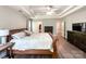 Large main bedroom featuring tray ceilings, wood floors, and an ensuite bathroom at 4823 Antioch Church Rd, Weddington, NC 28104