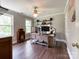 This office space is well-lit with hardwood flooring and plenty of space for a desk and shelving at 4823 Antioch Church Rd, Weddington, NC 28104