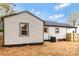 Exterior view of home's backyard features siding, wood fence, and manicured pine straw at 507 E Green St, Monroe, NC 28112