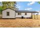 Home's backyard features wood fence, well-manicured lawn, and siding exterior at 507 E Green St, Monroe, NC 28112