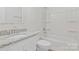 Clean bathroom features granite countertop, modern fixtures, and shower-tub combo at 507 E Green St, Monroe, NC 28112