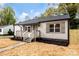 Quaint front of home with new porch and gray shuttered windows at 507 E Green St, Monroe, NC 28112