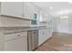 Beautiful kitchen featuring granite countertops, stainless steel appliances, and white cabinetry at 507 E Green St, Monroe, NC 28112