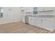 Modern kitchen featuring white cabinets, granite countertops, and stainless steel appliances at 507 E Green St, Monroe, NC 28112