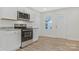 Well-equipped kitchen with stainless steel appliances, including a microwave, range, and oven at 507 E Green St, Monroe, NC 28112
