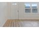 Inviting living room with wood-look floors, freshly painted, and filled with bright, natural light at 507 E Green St, Monroe, NC 28112