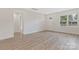 Bright living room featuring wood-look floors and ample natural light at 507 E Green St, Monroe, NC 28112