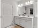 Well-lit bathroom with double sink vanity, white cabinetry, and elegant fixtures at 5119 Moselle Ave, Fort Mill, SC 29707