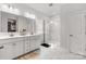Elegant bathroom featuring double sinks, a glass shower, and white cabinets at 5119 Moselle Ave, Fort Mill, SC 29707